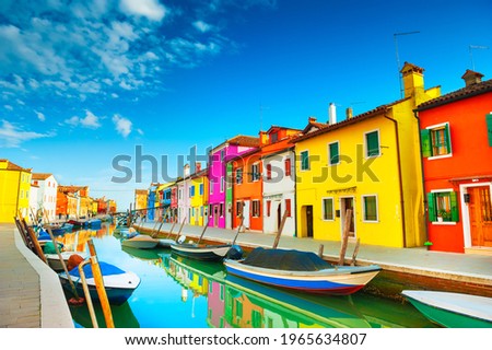Colorful houses on the canal in Burano island, Venice, Italy. Famous travel destination. Royalty-Free Stock Photo #1965634807