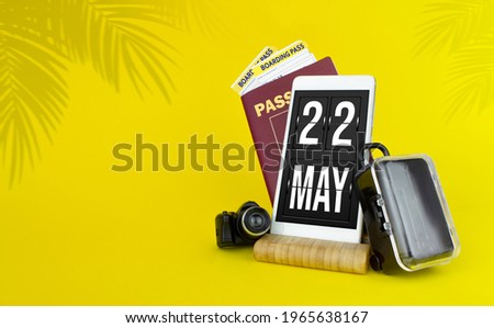 May 22nd. Day 22 of month, Calendar date. Mechanical calendar display on your smartphone. The concept of travel.  Spring month, day of the year concept