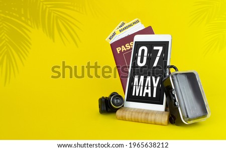 May 7th. Day 7 of month, Calendar date. Mechanical calendar display on your smartphone. The concept of travel.  Spring month, day of the year concept