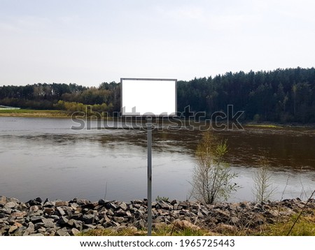 Template on a sign by the river with mockup. Withcopyspace background