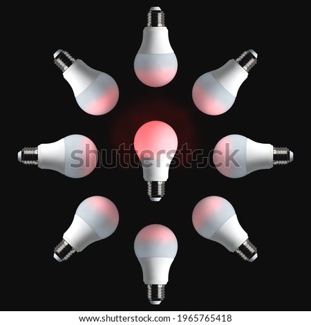 Red glowing bulb on black background. Idea, creativity, energy, invention, innovation, influence, leadership concept.