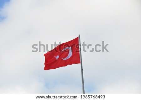 A Turkish flag waving in the sky