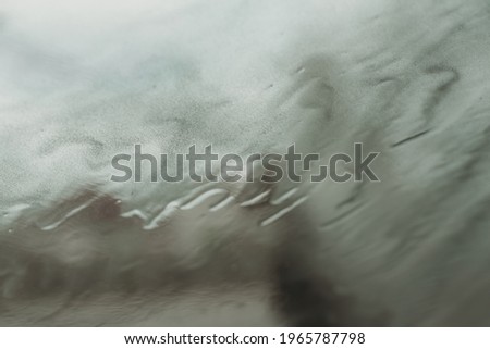 abstract rain and clouds on the glass background