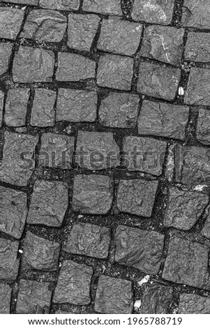 old broken stone path in cobble garden close up