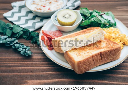 Breakfast image, toast bread with bacon and scrambled egg, comes with cereal, healthy morning concept