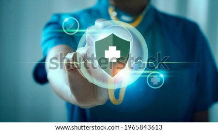 Medical doctor female holding stethoscope, immunity shield for protection from virus and bacterias, virus germs and prevention disease. Royalty-Free Stock Photo #1965843613