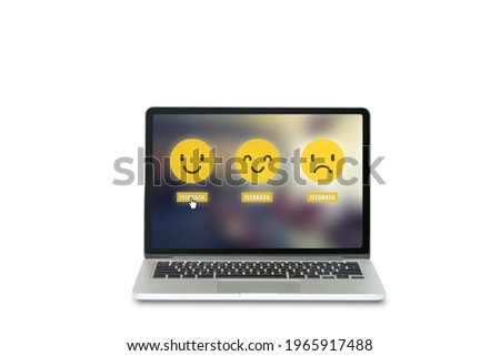 Customer Feedback Concept : Hand icon pointing and choosing yellow smile emotional icons for giving best service ranking on laptop. (Clipping path)