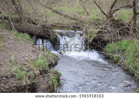 small river with a waterfall