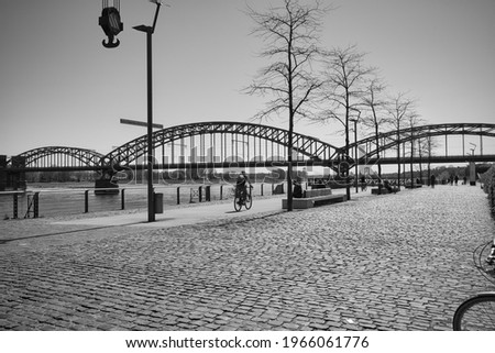 view from the rhine harbor to the south bridge in cologne. black and white photography