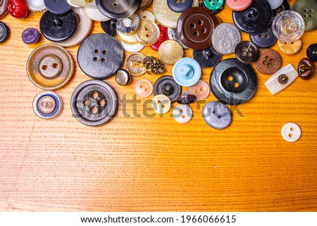 Different buttons on a background made of fabric