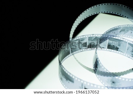 Analog black and white 35mm negative film strip on light table