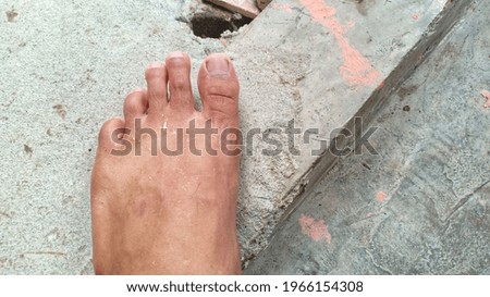 a photo of the foot of the person stepping on the wall