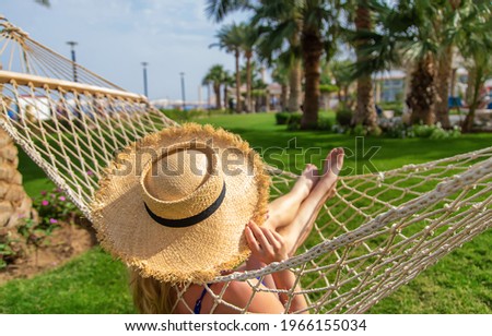 Woman relaxation on a hammock. Selective focus. People.