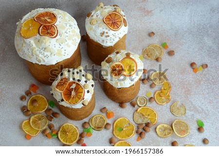 Many beautiful Easter cakes on a gray background