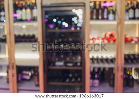 Interior of a fashion wine shop, wine restaurant. Blurred image for background uses.