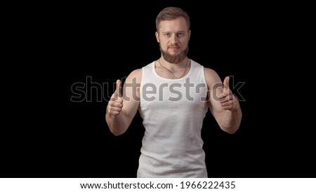 Joker. Jokes. It's funny. Fun. Emotions and gestures. Caucasian man with a beard is having fun. High quality photo