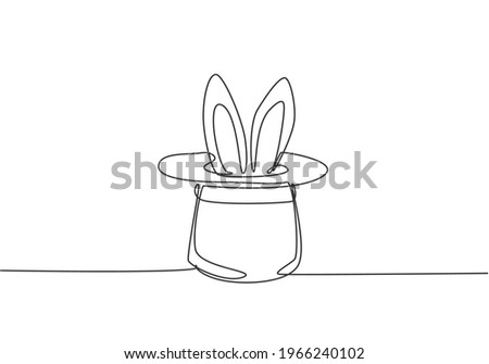 Single one line drawing the magic hat was turned upside down, then there were rabbit ears sticking out of it. A magic show at a circus performance. One line draw design graphic vector illustration.