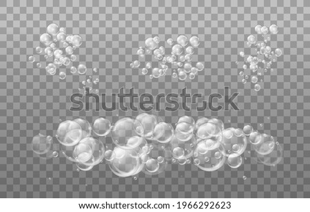 Realistic  set transparent bubbles of soapy water. Design elements for washing powder, shampoo, skin cosmetics.
Isolated on a transparent background.