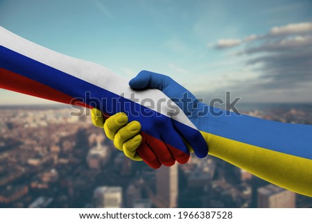 Shaking hands Russia and Ukraine Royalty-Free Stock Photo #1966387528