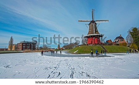 Winterfun near the windmills in Dokkum in the Netherlands