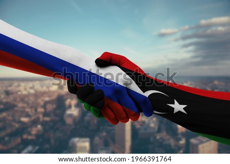 Shaking hands Russia and Libya