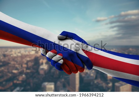 Shaking hands Russia and Costa Rica