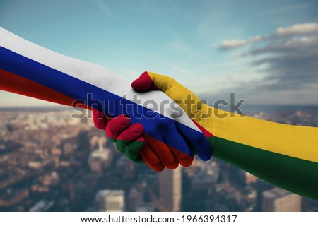 Shaking hands Russia and Guinea Bissau