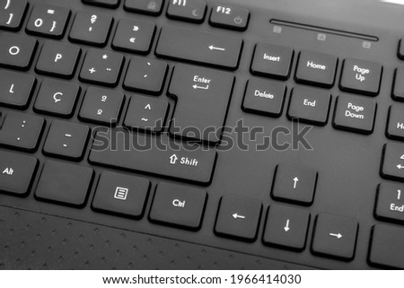 Close up view of a wireless black personal computer keyboard.