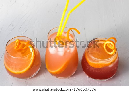 Soft drink made of soda, ice cubes and orange slices
