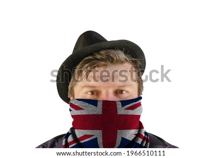 A middle-aged man wearing a black hat with small brim and a scarf over his face. A scarf with a picture of the flag of Great Britain. Unrecognizable Person on white background.