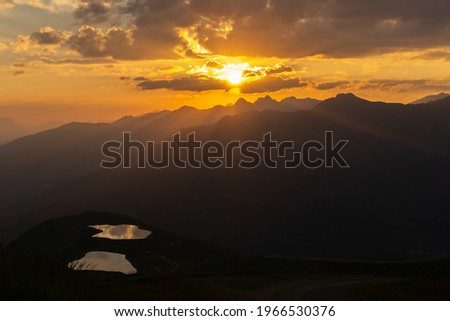 sun rise in the beautiful tyrolean alps. in the foreground two beautiful mountain lakes