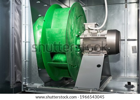 air handling unit internal exterior motor Exhaust plenum fan. Royalty-Free Stock Photo #1966543045