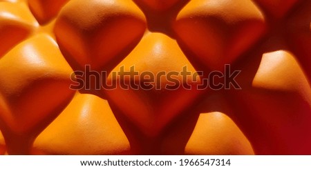 Orange yoga roller in the sun (macro, texture).