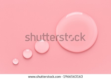 Water drops in speech bubble shape on pink background.