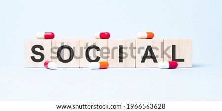 social word made on wooden cube blocks and flower in a pot on background. Health and medicine concept. Healthcare concept.