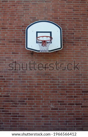 old basketball ring on the brick wall 
