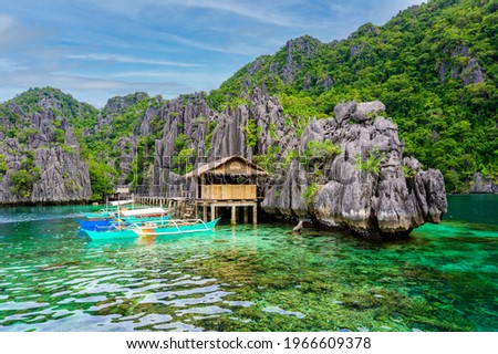 Twin Lagoon on paradise island with sharp limestone rocks, tropical travel destination - Coron, Palawan, Philippines. Royalty-Free Stock Photo #1966609378