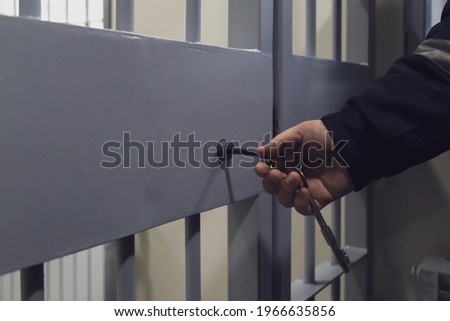 The door of a prison or detention center. Background Royalty-Free Stock Photo #1966635856