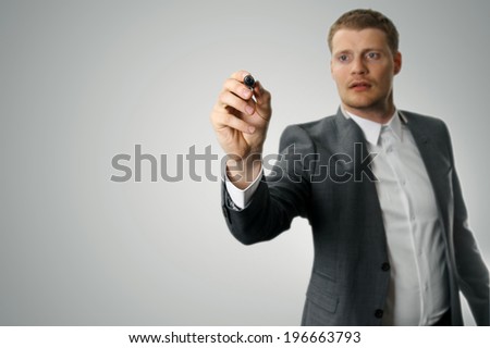 businessman with black marker in the hand