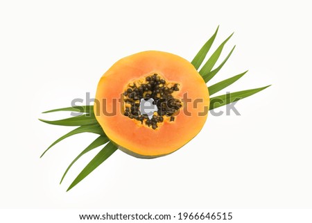 ripe slice papaya with leaves isolated on white background.