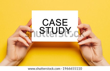 Female hands hold card paper with text Case Study on a yellow background. Business and education concept