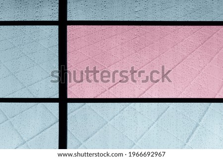 rain water drop on mirror with blue pink modern rectangular tile wall architecture background