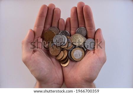 coins in hands. saving money concept.