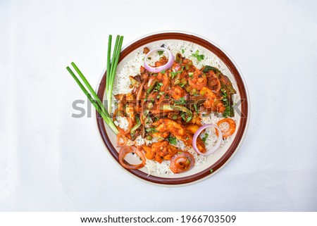 Rice and Curry Fish .Fish curry in pan on white stone table. Indian style food. Top view, flat lay, spicy
