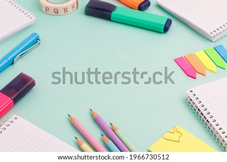 Stationeries and office supplies on turquoise background. Back to school concept. copy space for your text message or media and content.