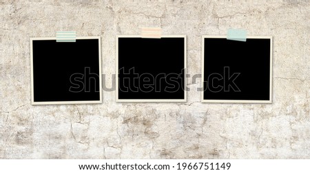 Three retro photos on old stucco wall. Vintage blank photo frames. Mock up template. Copy space for your text