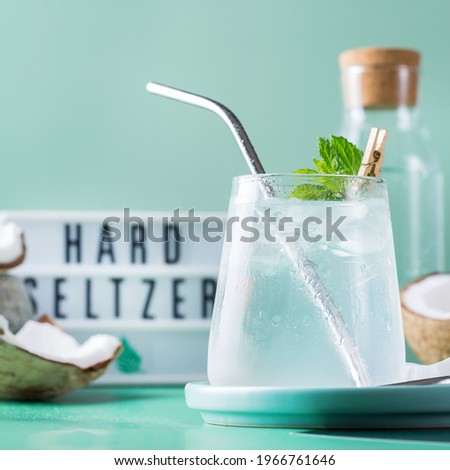 Tropical hard seltzer cocktail with coconut water and ice Royalty-Free Stock Photo #1966761646