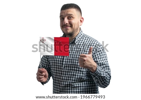 White guy holding a flag of Malta and shows the class by hand isolated on a white background. Like for Malta. Royalty-Free Stock Photo #1966779493