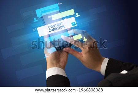 Hand using smartphone with social media concept