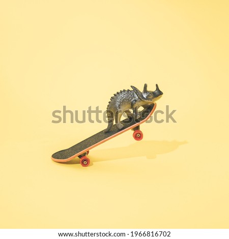 Triceratops on skateboard. Minimal design. Yellow background.